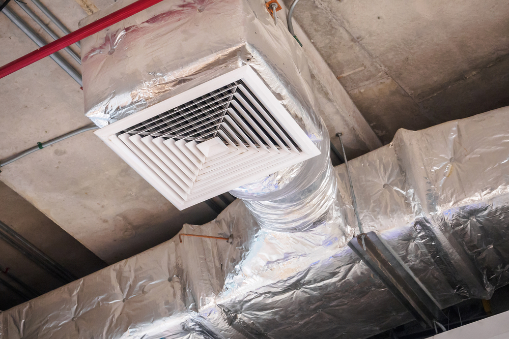Professional cleaning technician following a complete building cleaning guide for ducts and chimneys