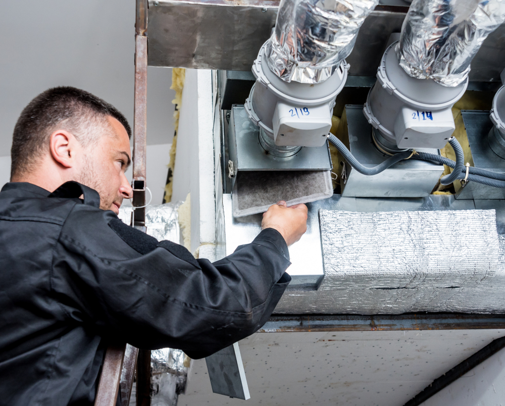 HVAC technician performing Glenview air duct cleaning to reduce allergens and improve indoor air quality for asthma sufferers