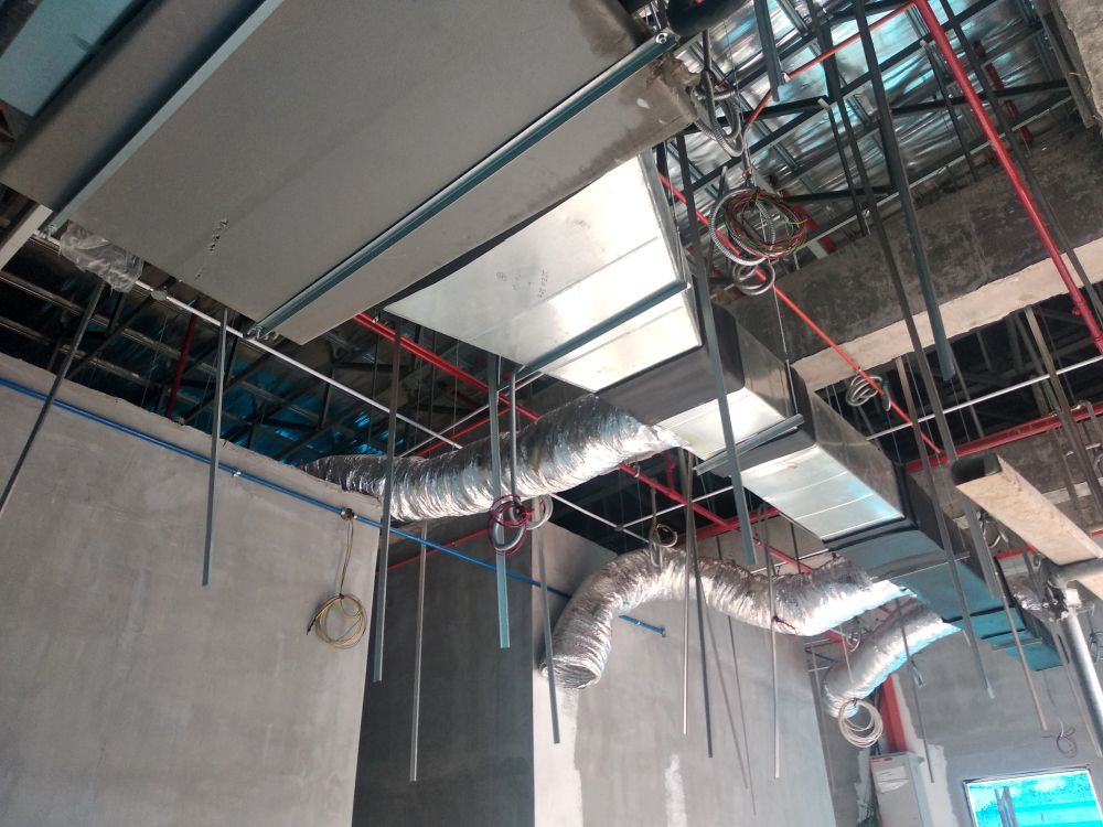 HVAC technician performing post-construction duct cleaning in an Aurora home after remodeling