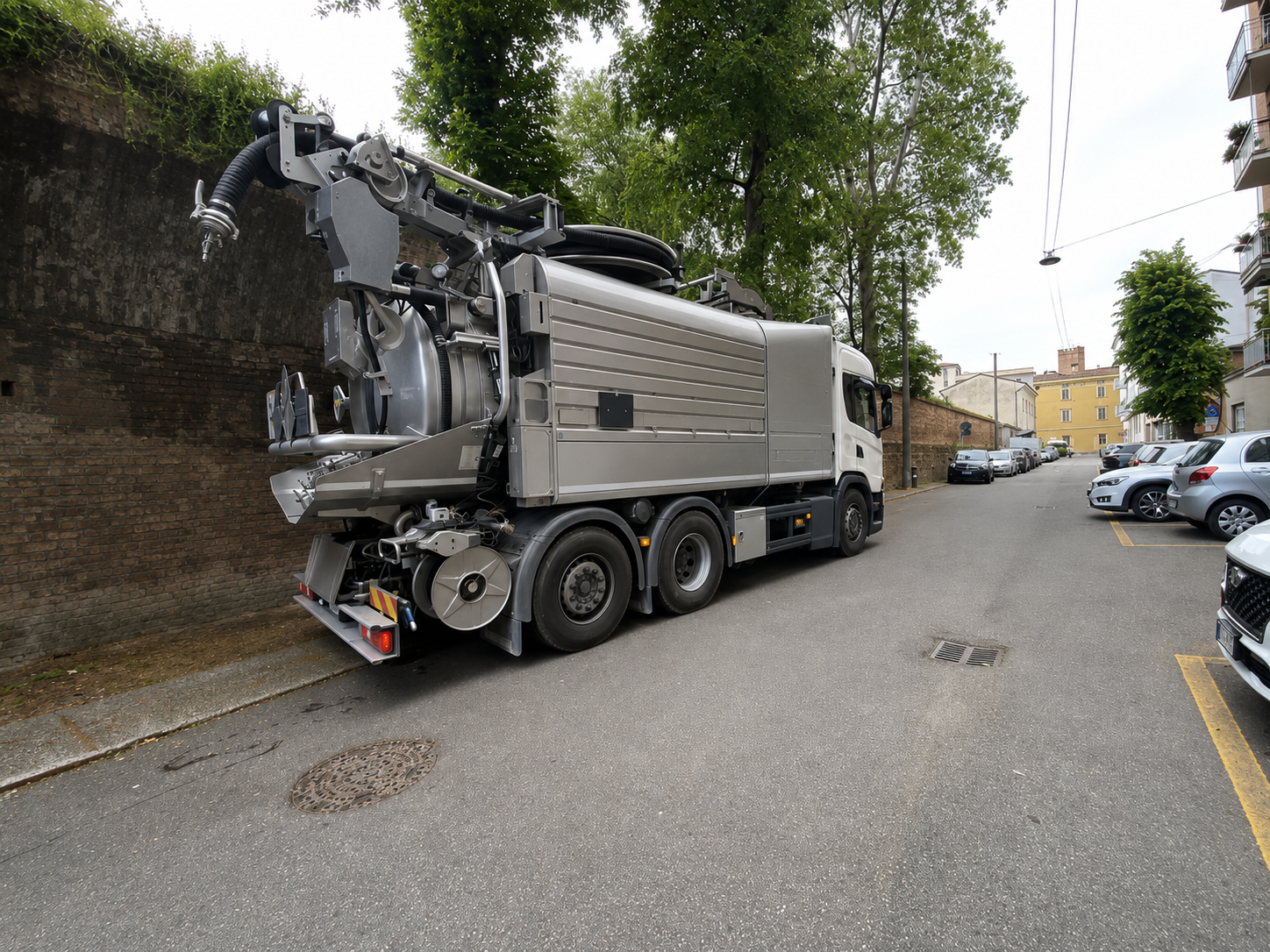 Professional truck-mounted vacuum systems cleaning residential air ducts during HVAC maintenance